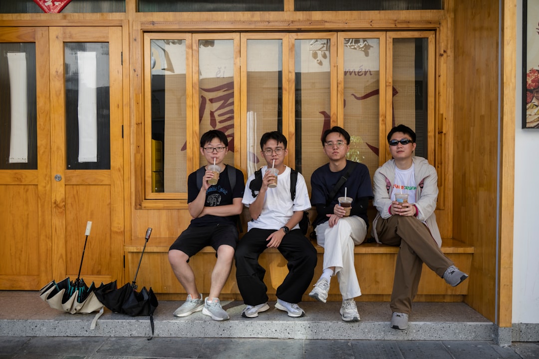 Group of Chinese officials in a formal setting, focus on the seating arrangement and facial expressions