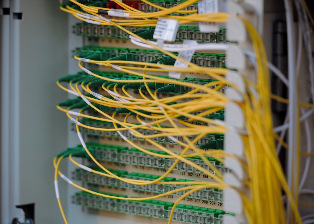 Close-up of a network router with flashing lights and connected cables