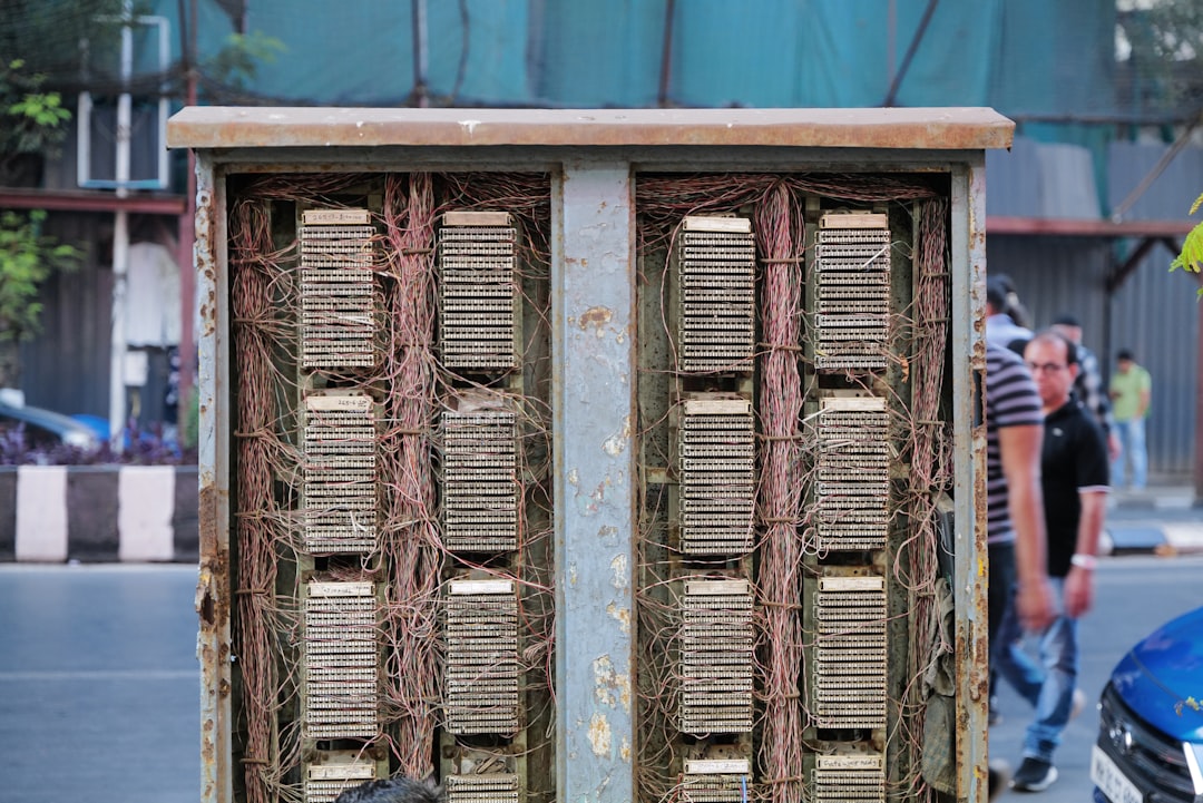 An old and dusty computer tower running CPU mining software, highlighting the low-tech entry point for learning about bitcoin mining