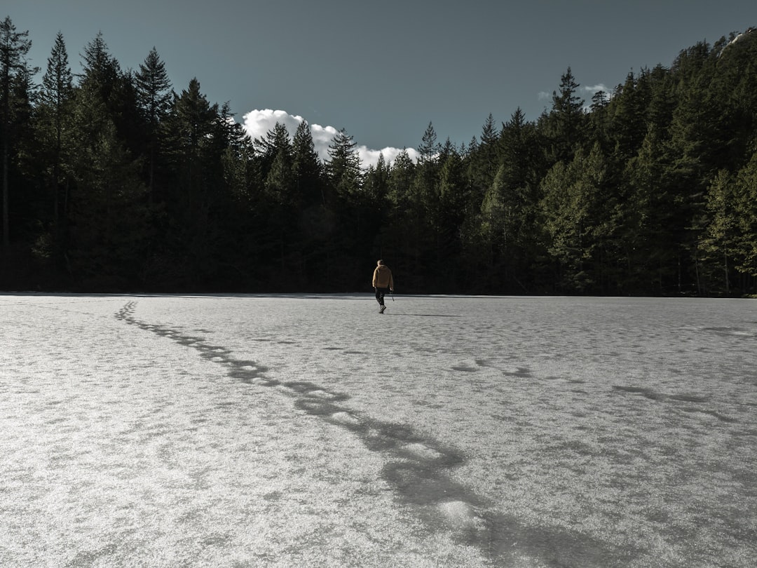 Snow-capped mountains reflecting in a pristine lake near Vancouver
