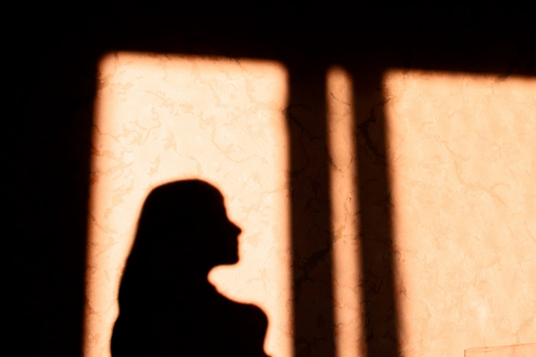 silhouette of pregnant woman in chains