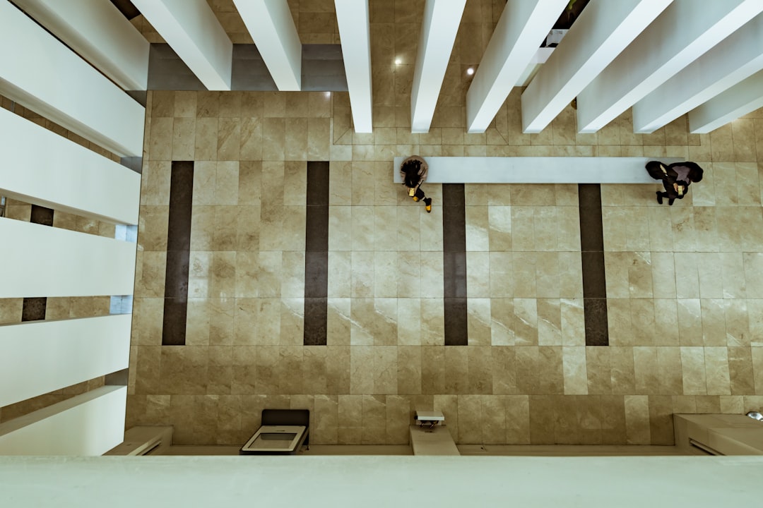 A gavel slamming down on a sounding block in a courtroom, symbolizing the weight of a legal decision.