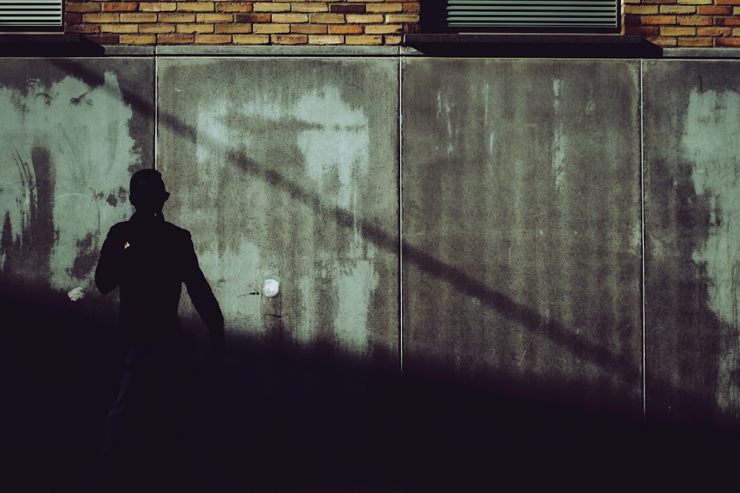 Shadowy figures in alleyway