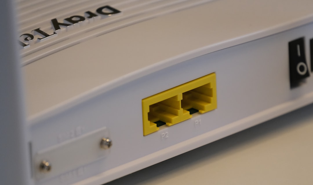 Router with multiple Ethernet cables plugged in, firewall icon displayed on the screen