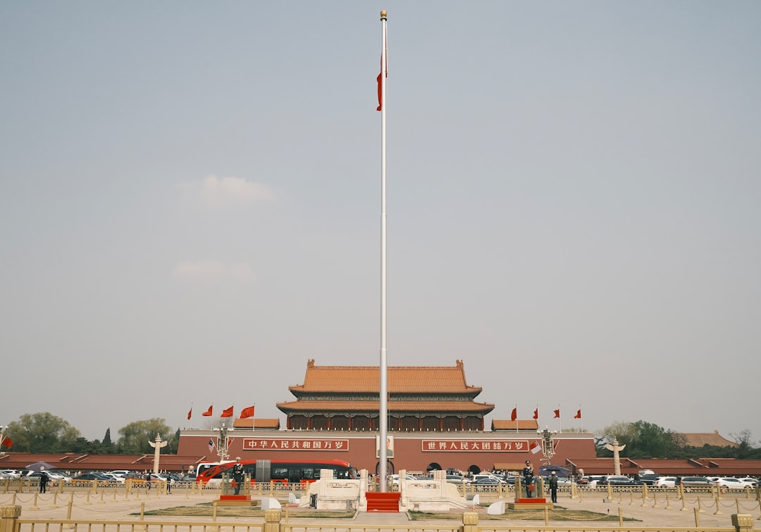 Black and white photograph of a large rally in Tiananmen Square during the Cultural Revolution