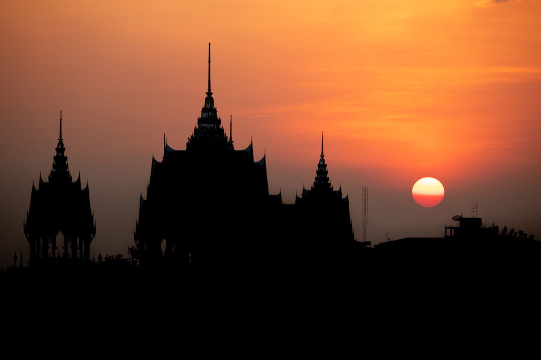 Thai temple at sunset. A serene and calming atmosphere reflects the focus on inner energy work.
