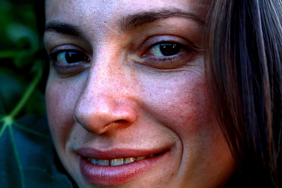 Close-up of a person's face showing genuine emotion while speaking