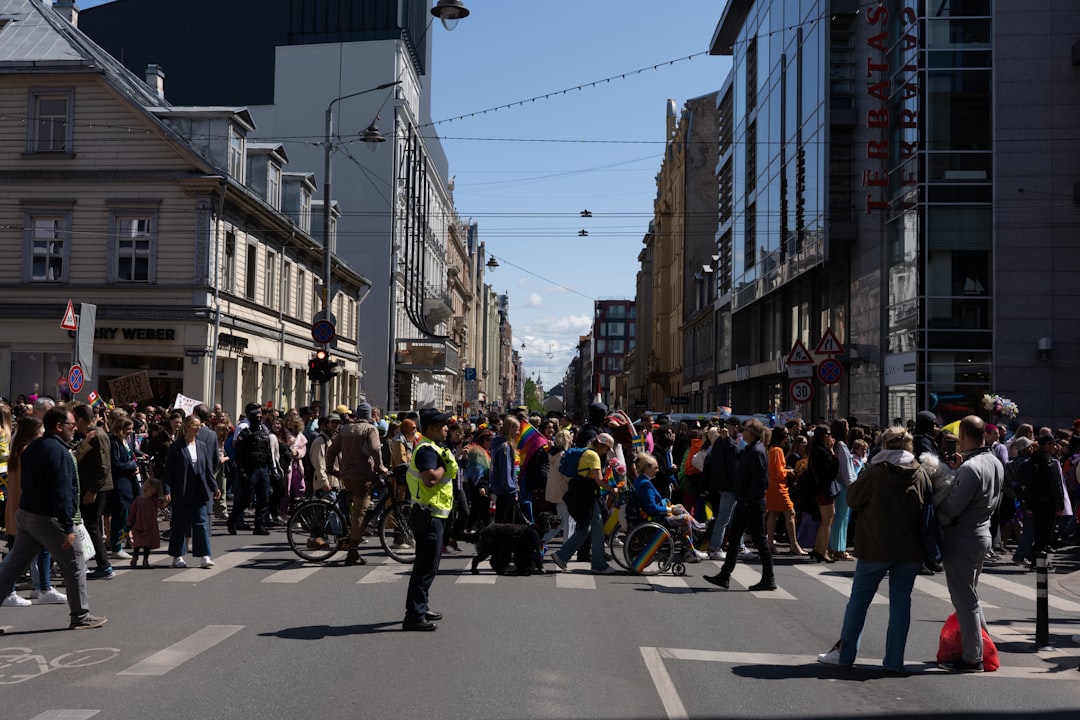 Crowded city street with people rushing and looking stressed